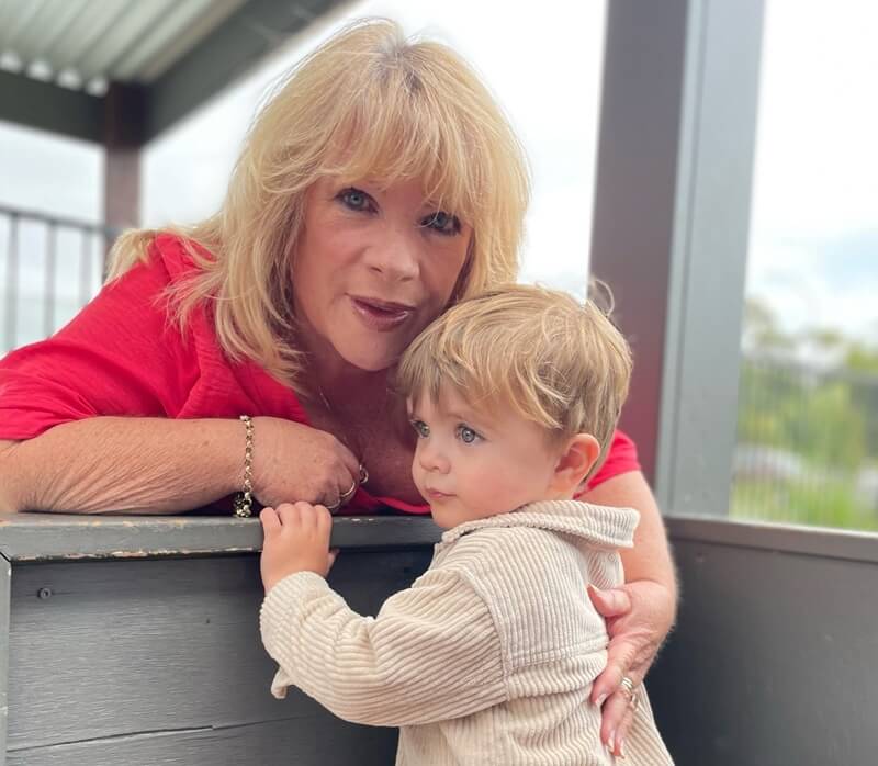Grandparents And Grandson Taking A Picture At Grandparents Day