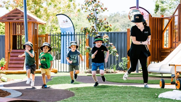 Educator Interacting With Preschoolers During Group Activity