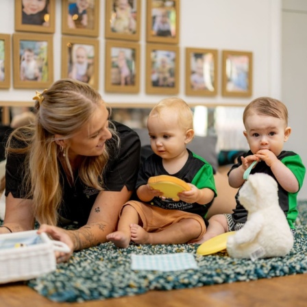 Babies Exploring Sensory Toys With Their Educator At Little Scholars Early Learning Centre
