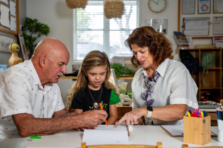 Grandparents And Granddaughters Enjoying Learning At Little Scholars