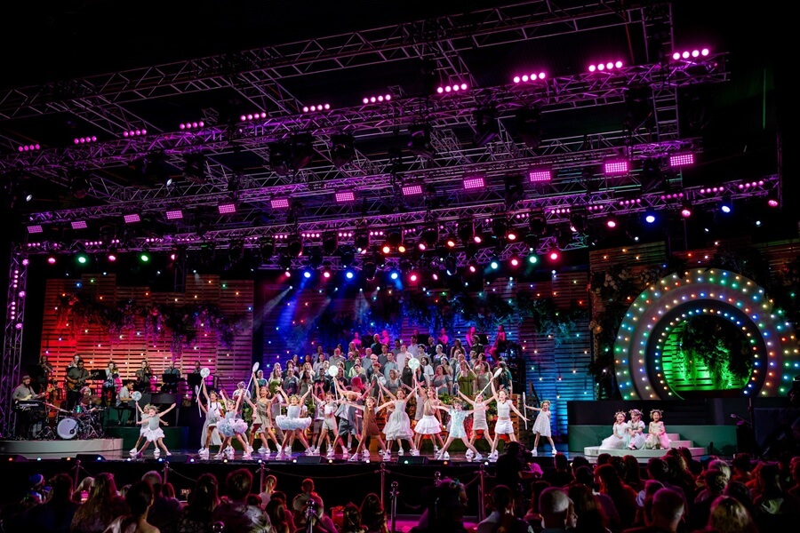 Family Christmas Events Brisbane Gold Coast Ipswich featuring a festive stage performance with dancers, choir and colourful lights