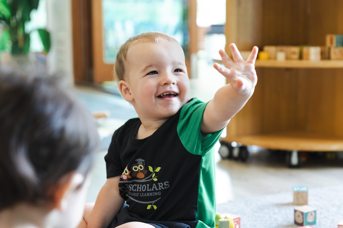 Smiling Toddler Raising Hand Early Learning