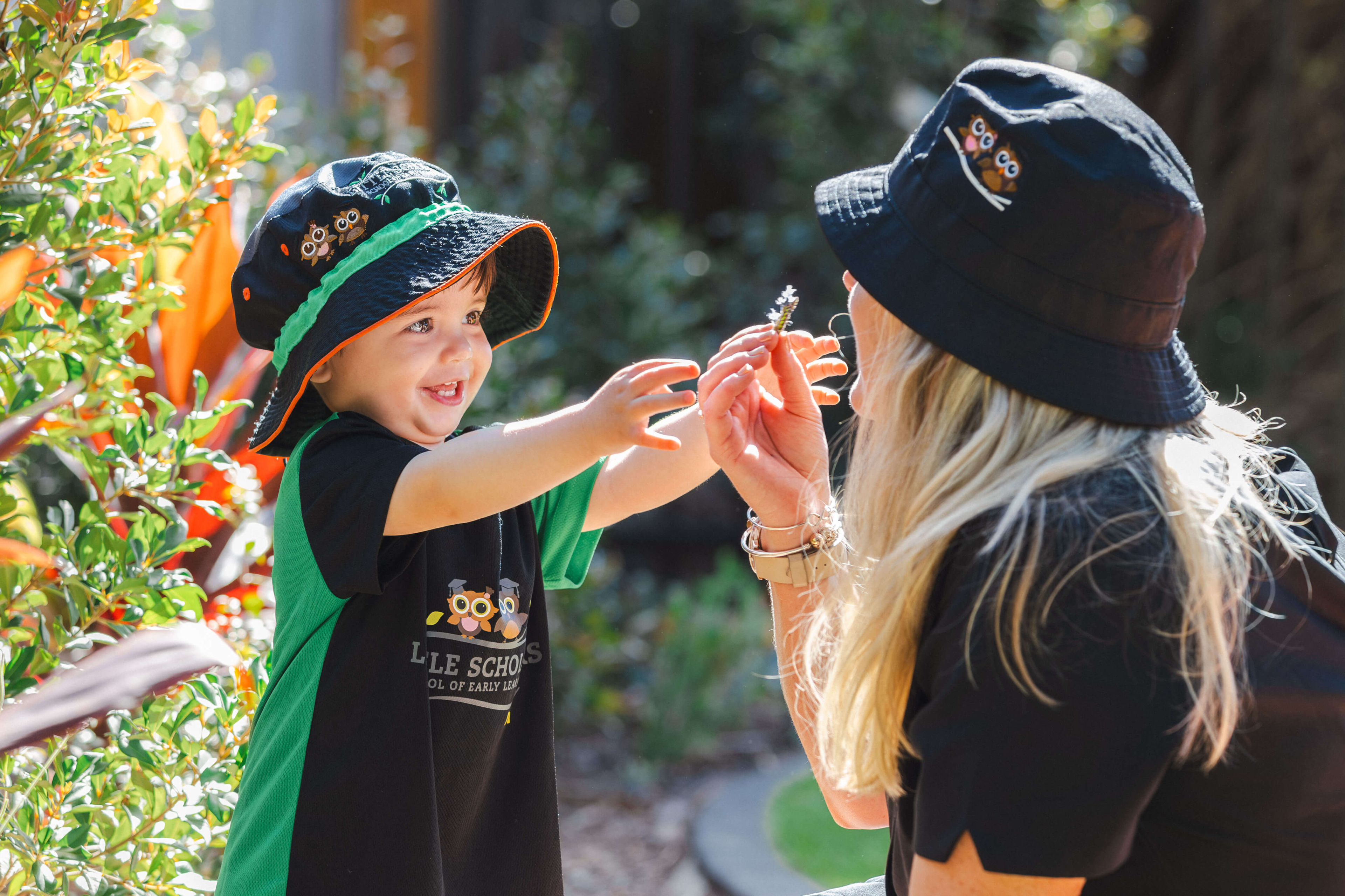 Nursery Early Learning Outdoor Sensory Play with Educator at Little Scholars