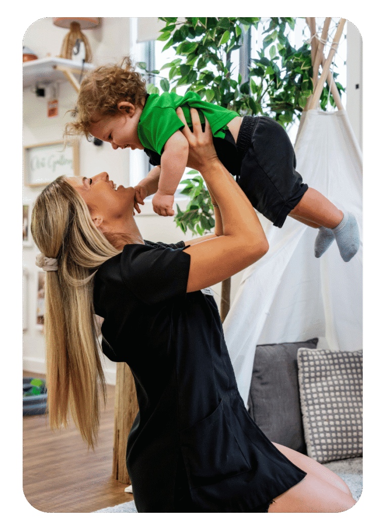 Toddler And Educator Bonding At Early Learning Nursery