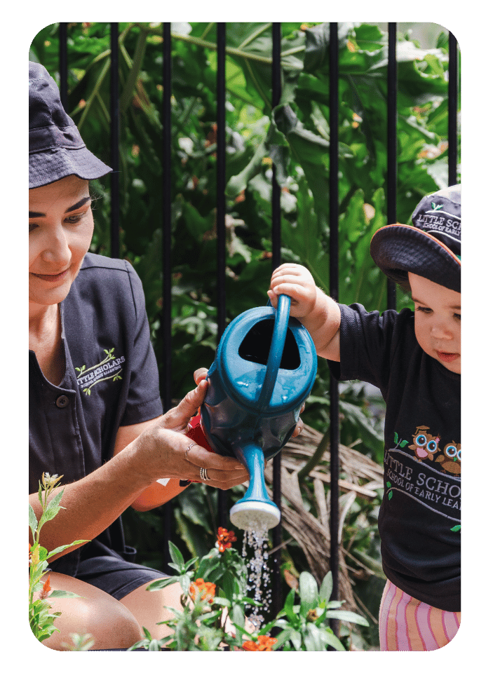 Toddler Watering The Plants