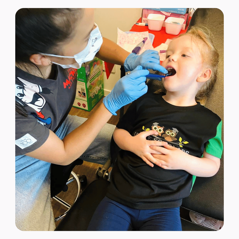 Dentist Checking Little Scholar Kids Teeth