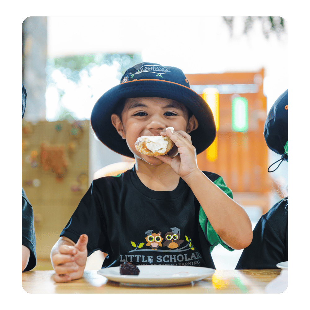 Child enjoying a mealtime at Little Scholars